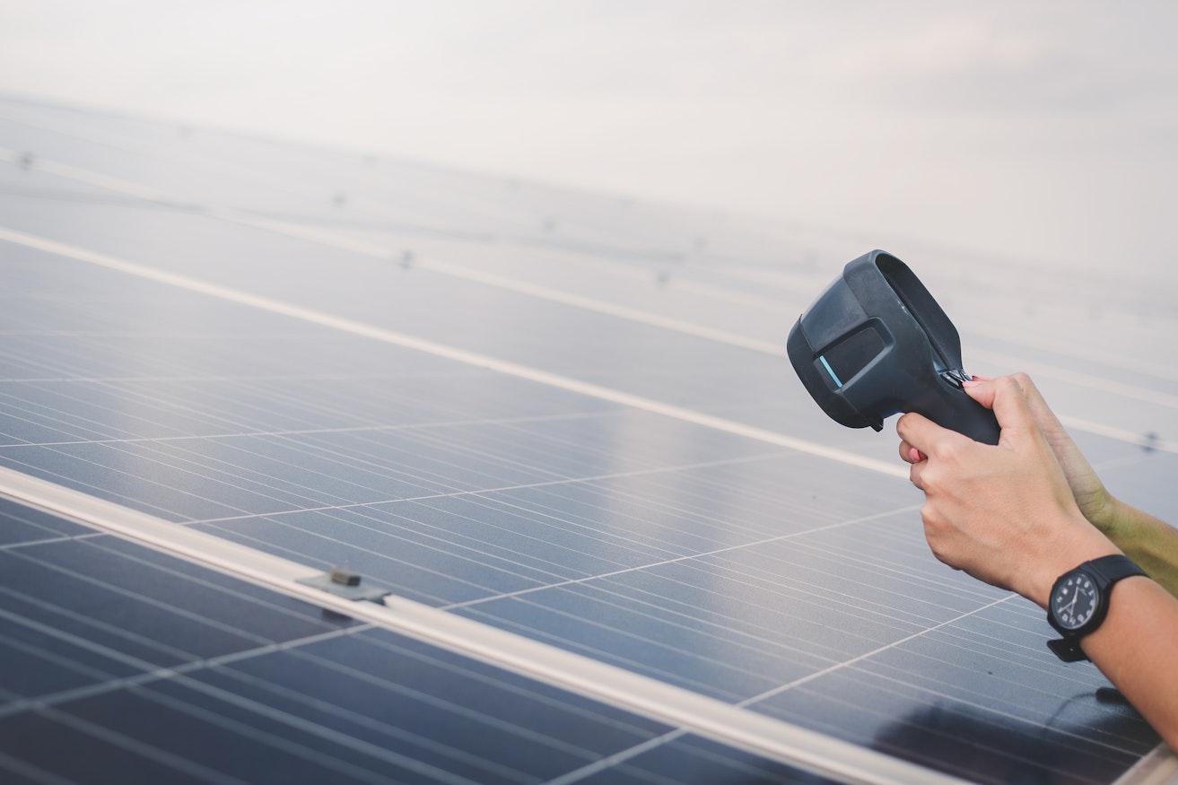 woman-engineer-using-thermal-imager-check-temperature-heat-solar-panel