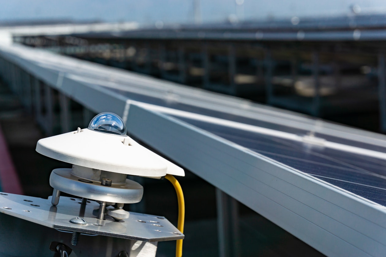 pyranometer-measuring-irradiance-solar-farm-with-blue-sky-solar-cell-plant