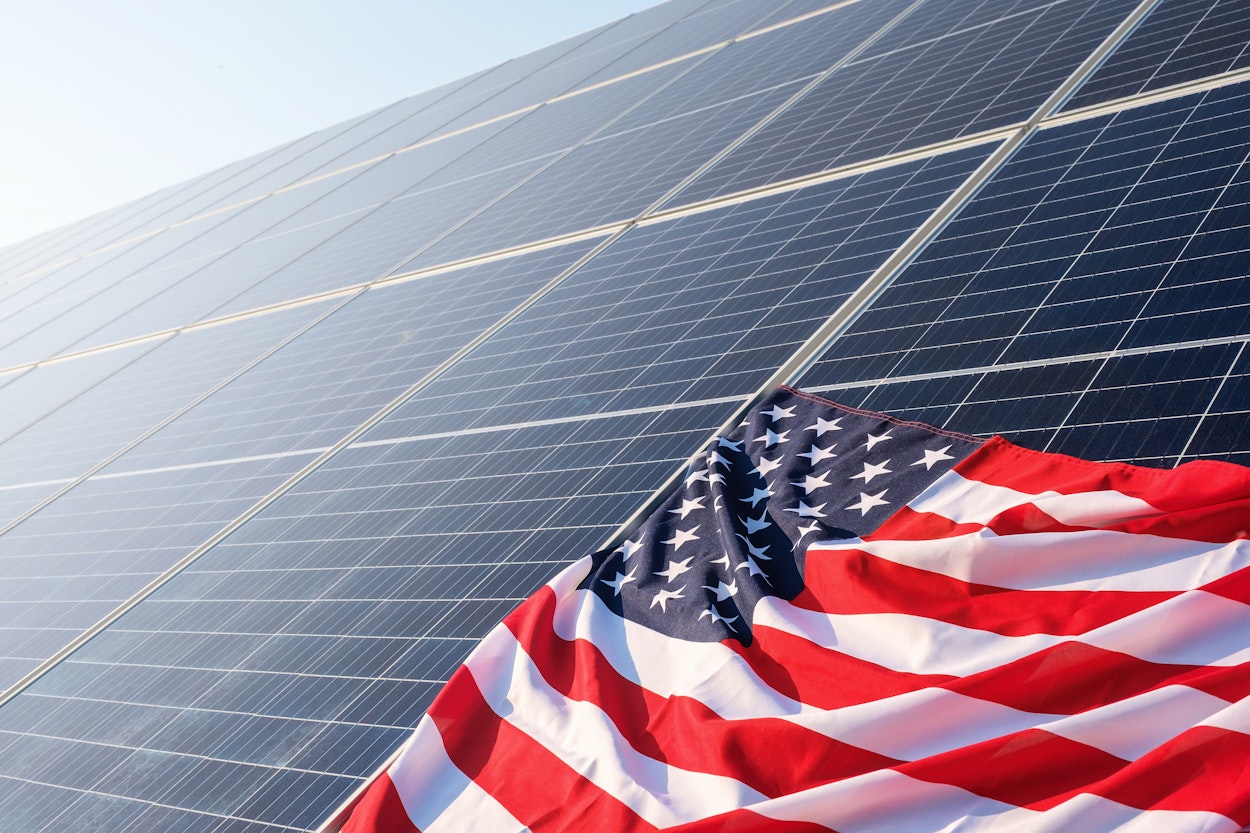 american-flag-close-up-solar-panels-solar-power-plant