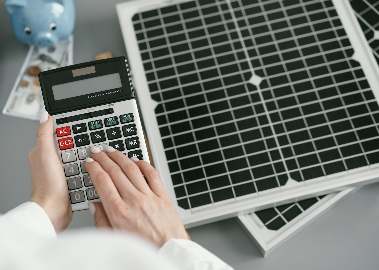 calculator next to solar panel