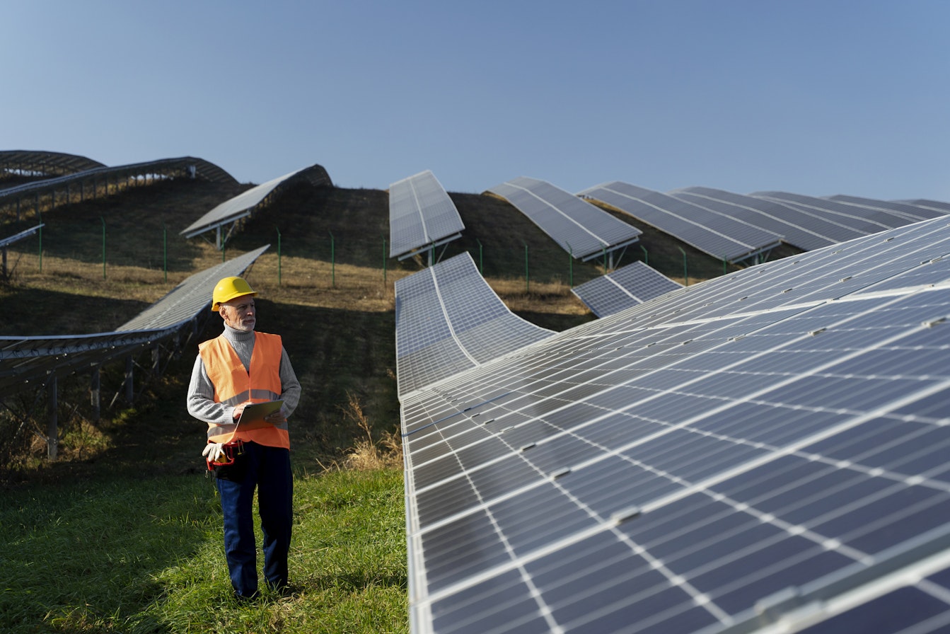 person near solar panel