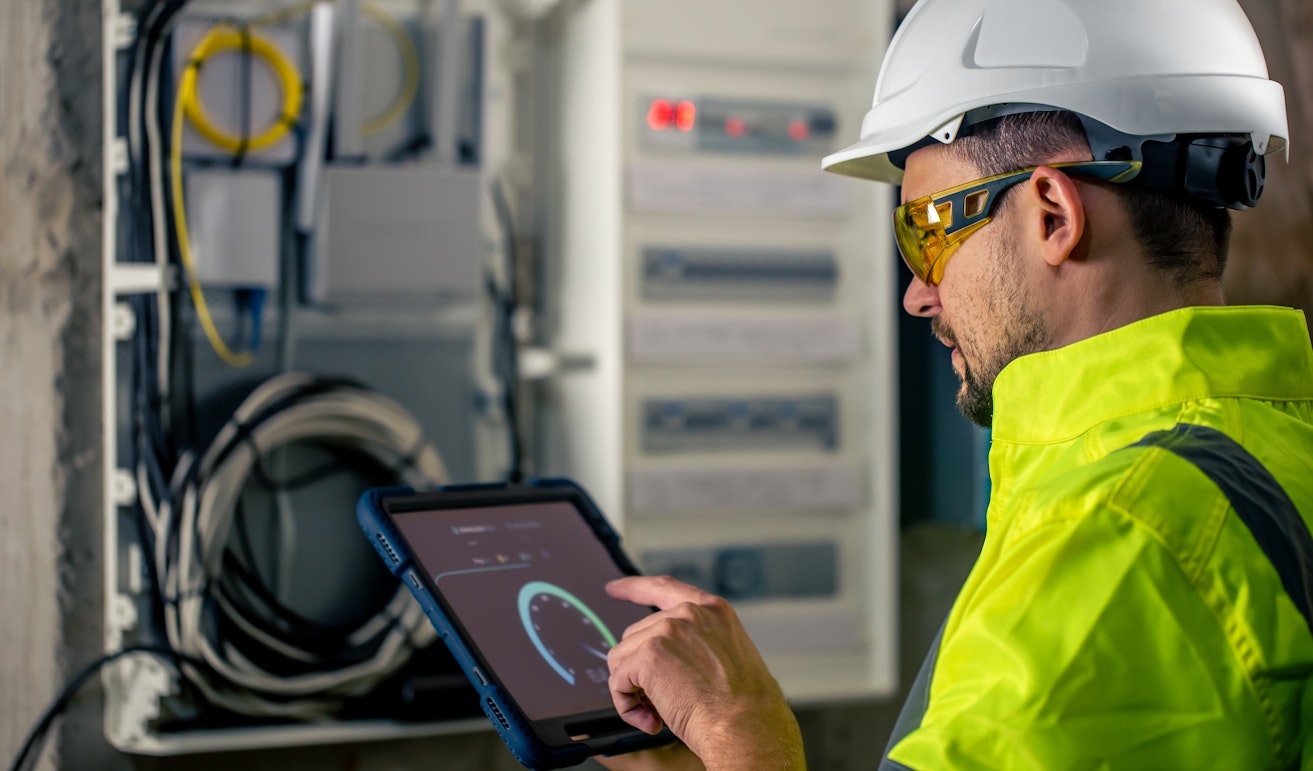 electrical technician working in a switchboard